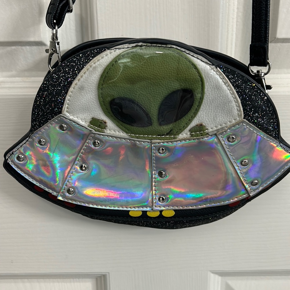 Small Alien in Spaceship Crossbody Purse with holographic design.